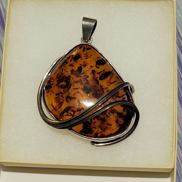 Elegant Amber Pendant with Silver Accents